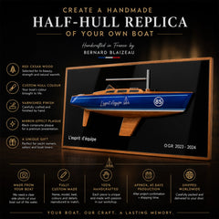 Handmade half-hull boat replica crafted in red cedar with custom hull colour and mirror-effect plaque.